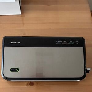 FoodSaver Vacuum Sealer in Black and Silver with accessories